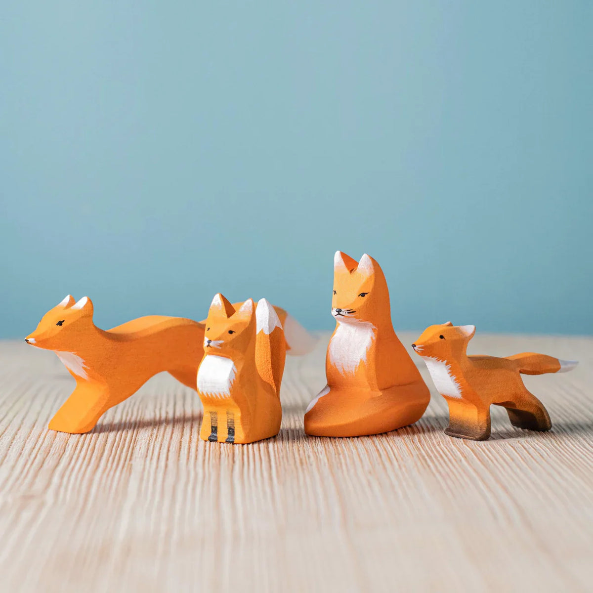 Bumbu Fox Family — hand-carved wooden fox family, a predator model for the woodland food web