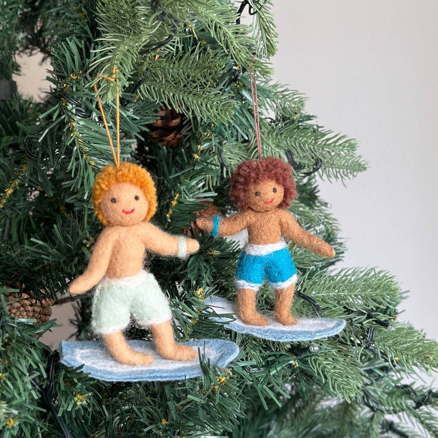 Felt Ornament - Surfer Boy, a wool felt ornament by Ganapati Crafts Co., needle-felted and hand-stitched in Nepal