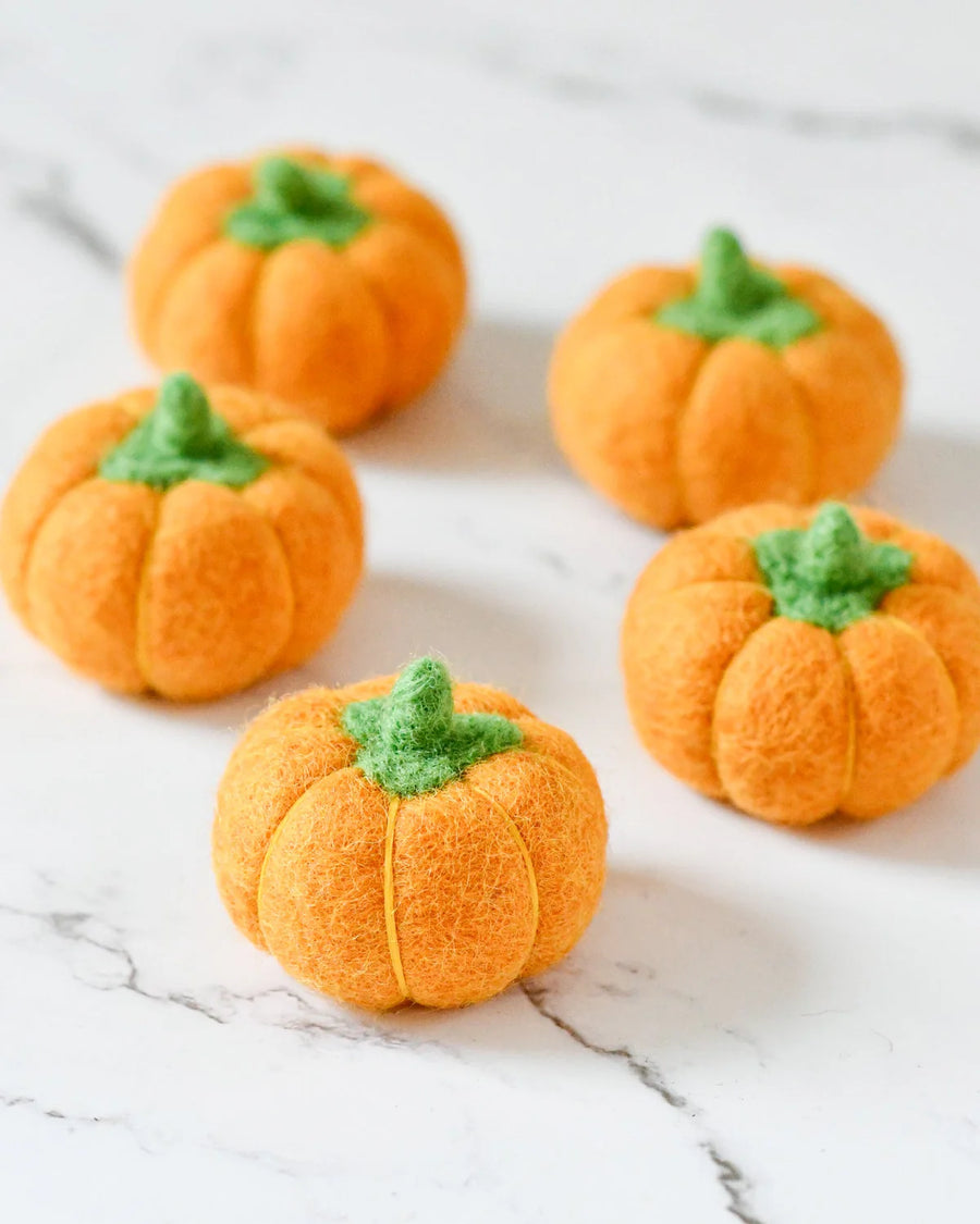 Second view of the felt pumpkins showing their rounded ribbed shape