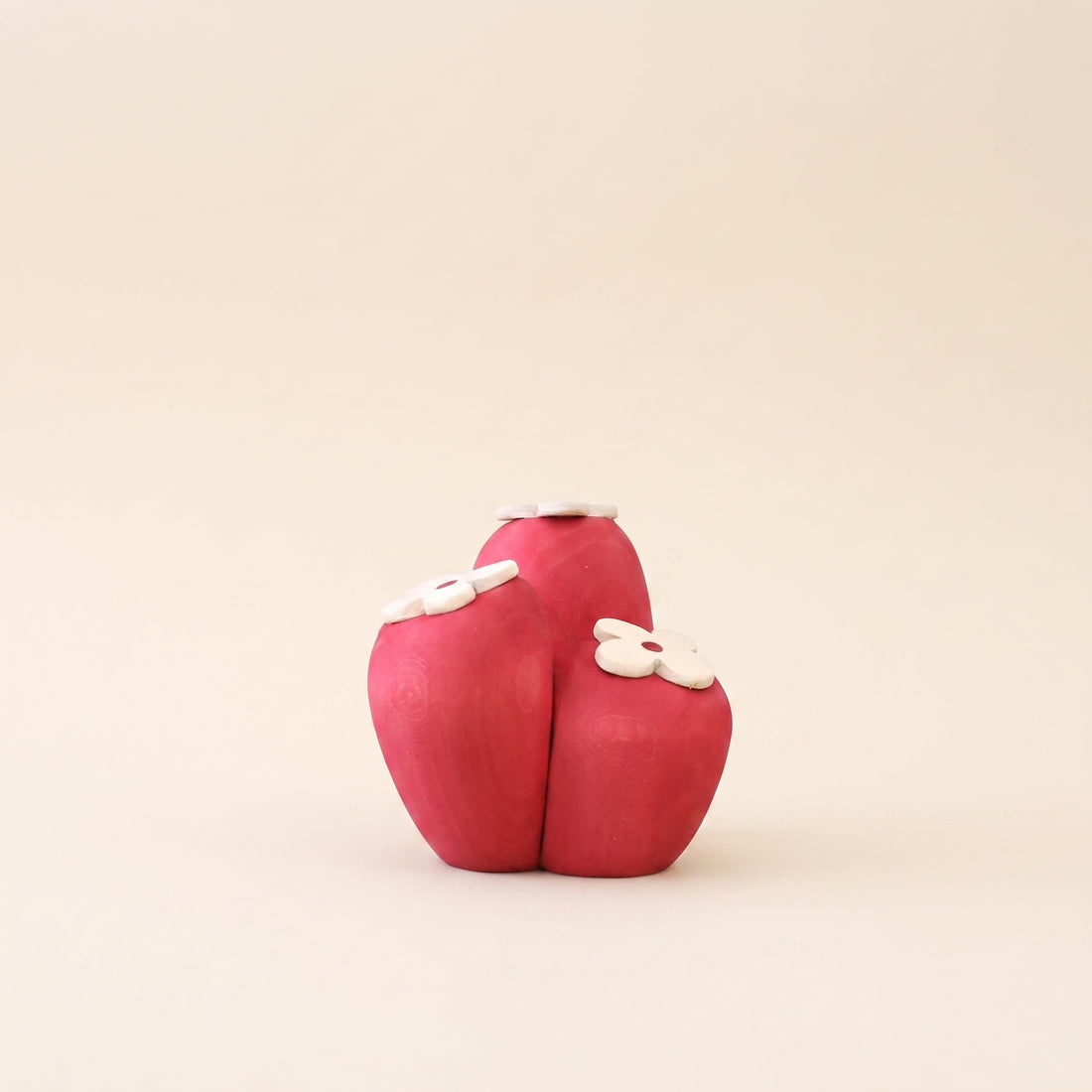 Wooden soft coral carved as a single rounded bloom in deep coral red