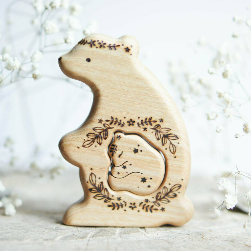 Hand-carved wooden bear pregnancy announcement puzzle with a baby tucked inside the belly, by Tiny Fox Hole