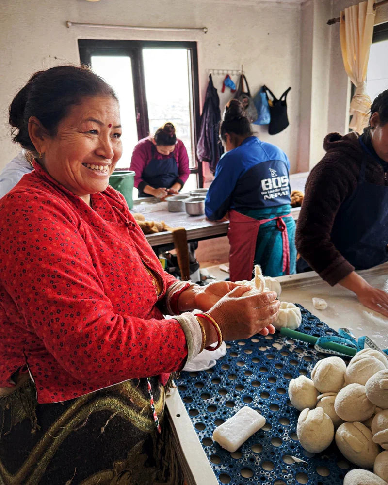 Nepalese woman artisan hand-crafting felt in a Tara Treasures workshop in Nepal