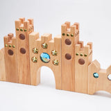 Side view of the Bauspiel Small Fairytale Castle showing tall towers with gold star and blue gem insets · view 2
