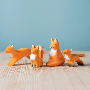 Bumbu Fox Family — hand-carved wooden fox family, a predator model for the woodland food web