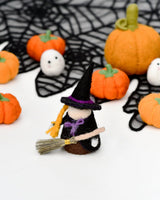 Second view of the felt witch peg doll with her broom · view 2