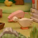 Wooden goose shown from the side, carved from linden wood with a smooth painted finish · view 2