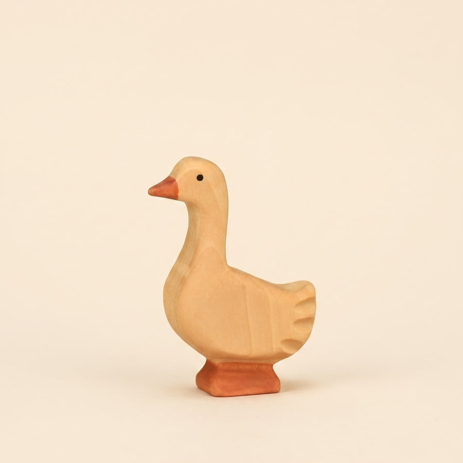 Mako Toys wooden goose standing with its head up and neck extended, painted cream with an orange bill