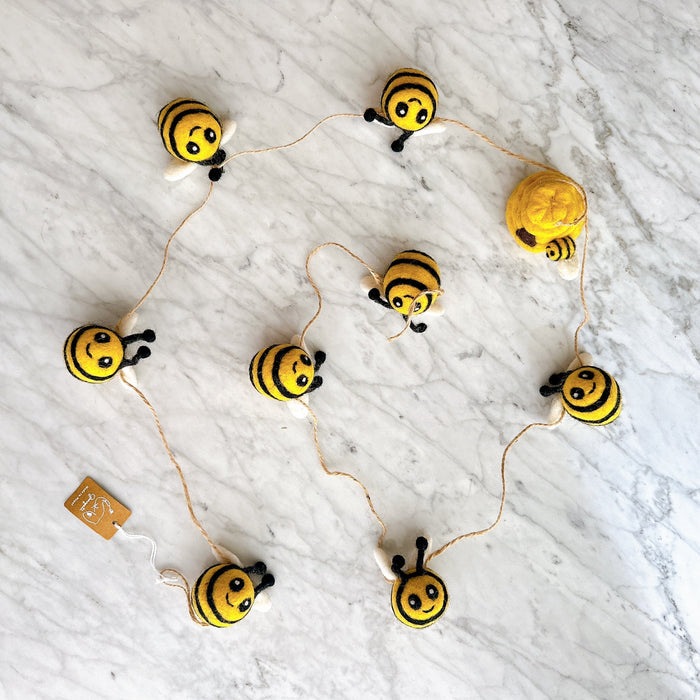 Handmade wool felt garland with cheerful yellow bees