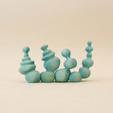 Wooden coral in soft mint green, a cluster of rounded columns stacked in bulbs · view 1