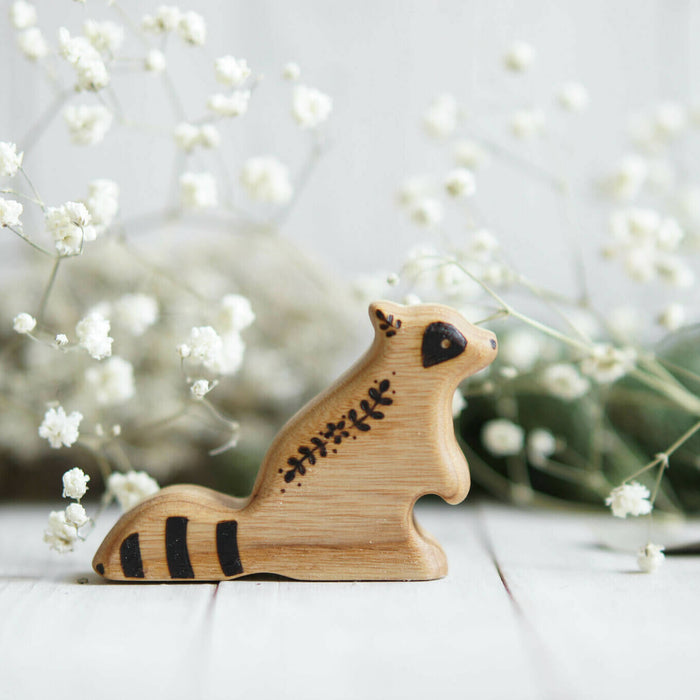 Wooden Baby Raccoon, Sitting, a natural wood animal toy by Tiny Fox Hole, cut and finished by hand from solid wood