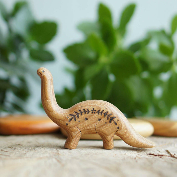 Wooden Baby Brontosaurus, a natural wood animal toy by Tiny Fox Hole, cut and finished by hand from solid wood