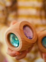 Close-up of the Bauspiel Magic Cube Pastel showing the pastel faceted gems set in alder wood · view 2