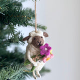 Bouquet-Bearing Sheep Ornament, a wool felt ornament by Ganapati Crafts Co., needle-felted and hand-stitched in Nepal · view 1