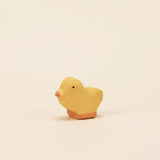 Mako Toys wooden chick, a small yellow bird with an orange beak on a painted base · view 1