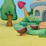 Close view of the wooden mallard duck's painted green head and yellow bill · view 4