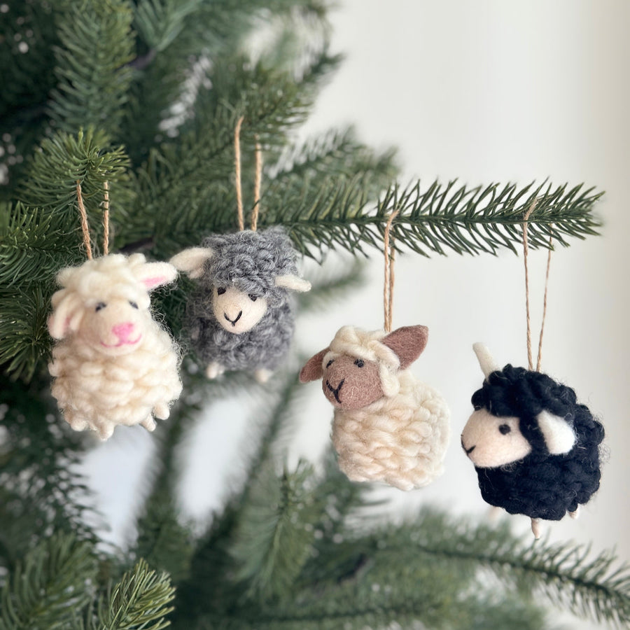 Felt Mini Sheep Ornament, a wool felt ornament by Ganapati Crafts Co., needle-felted and hand-stitched in Nepal