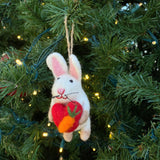Felt Ornament - Bunny Holding A Heart, a wool felt ornament by Ganapati Crafts Co., needle-felted and hand-stitched in Nepal · view 1
