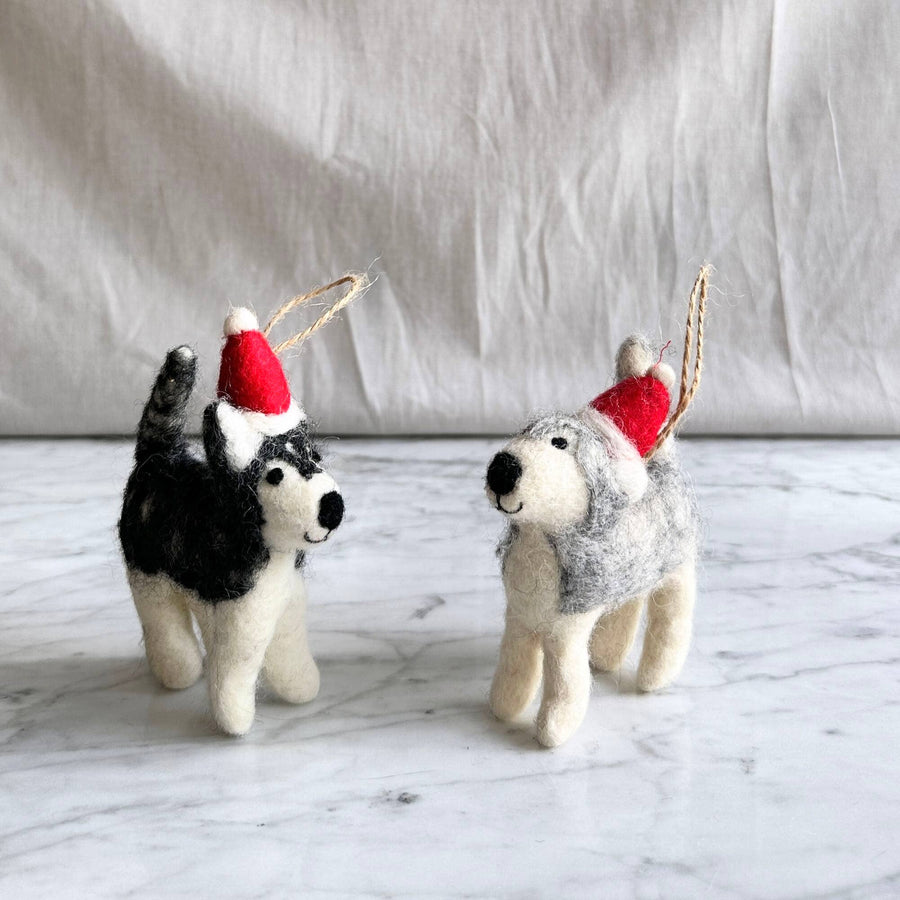 Felt Ornament - Husky with Christmas Hat, a wool felt ornament by Ganapati Crafts Co., needle-felted and hand-stitched in Nepal