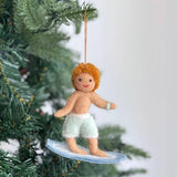 Felt Ornament - Surfer Boy, a wool felt ornament by Ganapati Crafts Co., needle-felted and hand-stitched in Nepal (view 2) · view 2
