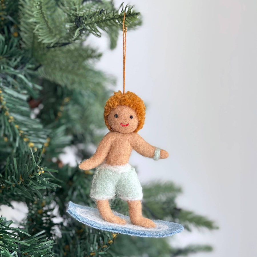Felt Ornament - Surfer Boy, a wool felt ornament by Ganapati Crafts Co., needle-felted and hand-stitched in Nepal (view 2)