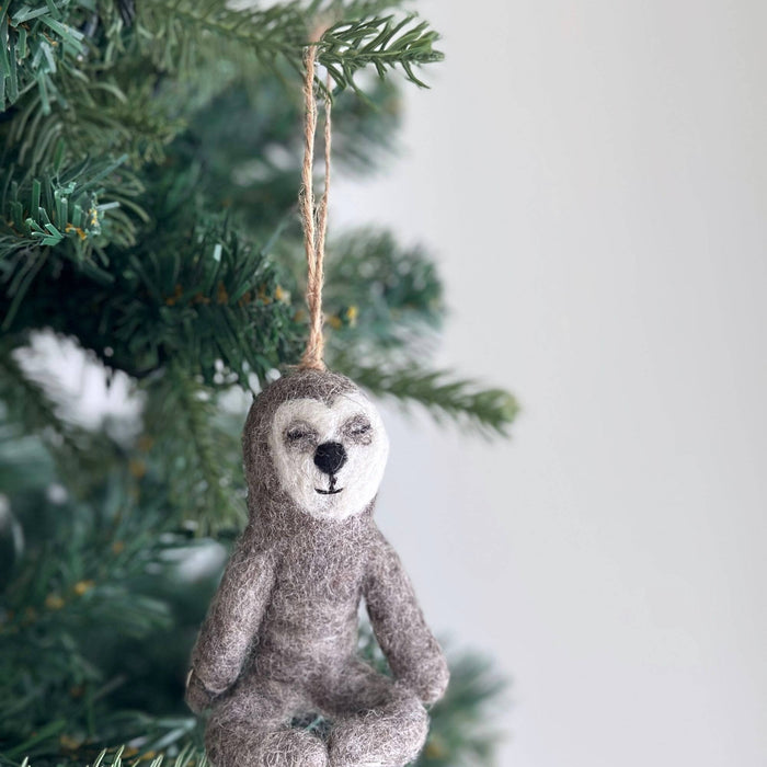 Felt Yoga Sloth Ornament, a wool felt ornament by Ganapati Crafts Co., needle-felted and hand-stitched in Nepal