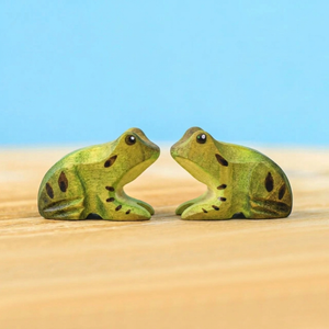 Two wooden frogs