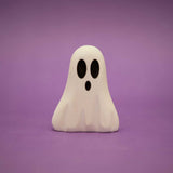 Small wooden ghost painted white with two dark oval eyes and an open mouth · view 1