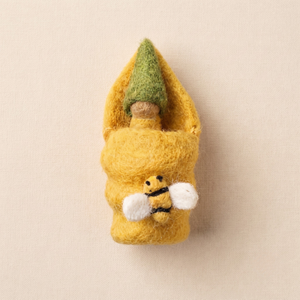 Honeybee Baby, a wooden peg baby in a felt honeycomb bed