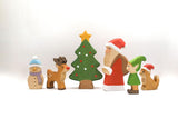 Juharka wooden Christmas figures shown together for scale: snowman, reindeer, tree, Santa, elf and cat · view 2