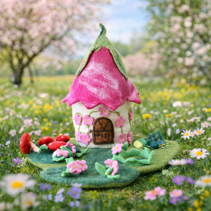 Pink Blossom Fairy House, a hand-felted fairy home with a curled pink petal roof and embroidered cherry blossoms
