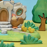 Wooden rooster shown in profile, hand-painted in brown and cream · view 2