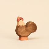 Mako Toys wooden rooster with a red comb and upright tail, standing on a painted base · view 1