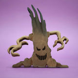 Pale wooden tree with a carved face and curling bare branches, standing on its own base · view 1