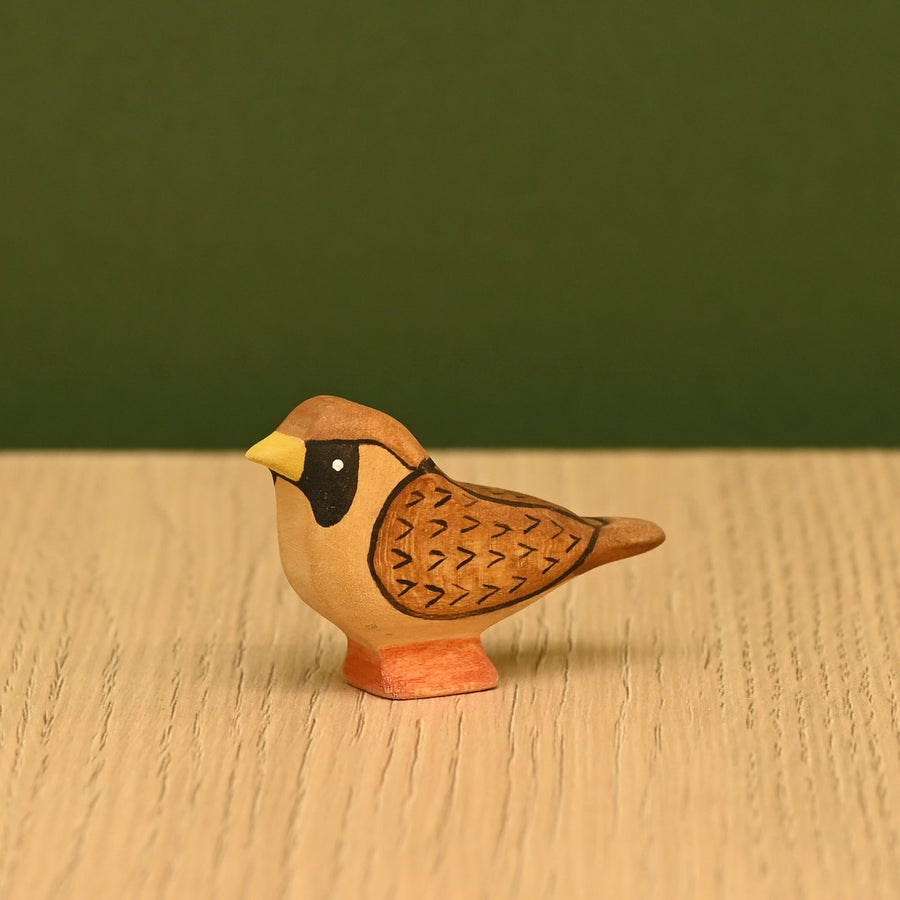 Hand-painted wooden sparrow shown from the side, small enough to perch on a fence rail or roof