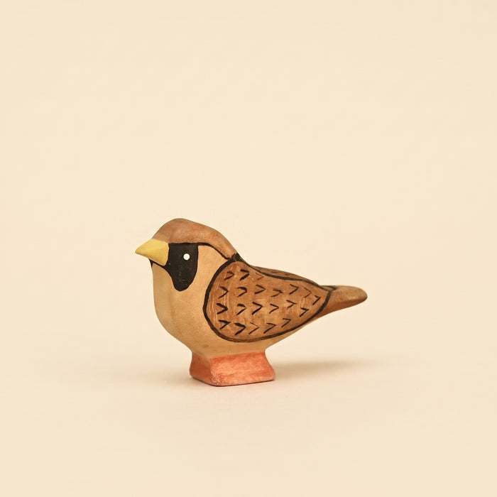 Mako Toys wooden sparrow with a black mask and painted wing markings on a small base