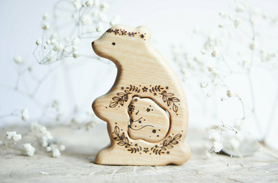 Hand-carved wooden bear pregnancy announcement puzzle with a baby tucked inside the belly, by Tiny Fox Hole